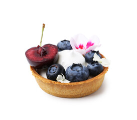One sweet tartlet with berries and flowers isolated on white. Delicious dessert