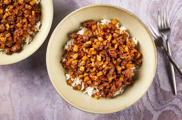 Rice and Meat Bowl with Nuts in Cozy Setting