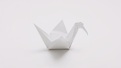 Folded paper bird displayed on a clean white background