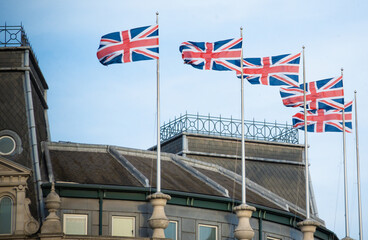 English flag hanging above public street