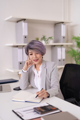 Asian Adult Businesswoman Strategic Planning Work Professional Executive Office Desk Writing Notes Career Management Entrepreneurial Success