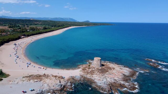 Cinematic Drone Flyover of Torre di Bari Sardo Beach and Coastal Tower, Sardinia, Italy