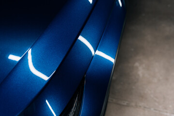 Close-up of blue SUV fender and door with glossy ceramic coating – perfect reflections and clean...