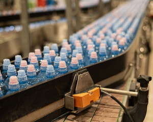 Bottled water on a conveyor belt at a factory. 