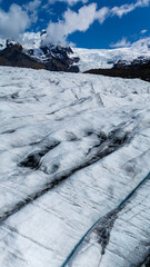 A breathtaking view of Svinafellsjokull Glacier showcases its majestic crevasses and icy surface.