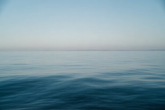 Calm ocean horizon with gentle waves water