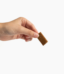 Girl holding a chocolate bar in hand on white background