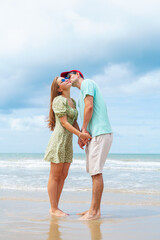 Romantic Couple Kissing on Beach, Caucasian Man and Woman in Love Sharing Affectionate Moment on Summer Vacation by the Sea