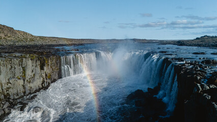 Selfoss, one of Europes most powerful waterfalls, set in rugged terrain with a picturesque rainbow...