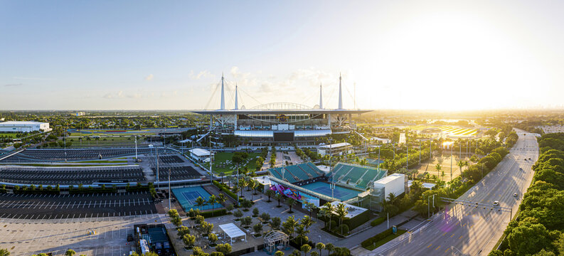 Miami Gardens, United States - 19 July 2025: Aerial view of the Hard Rock Stadium basks in the golden glow of the setting sun, a modern coliseum.