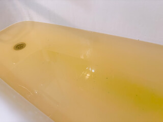 Rusty water, brown in color.Poor quality water in the bathroom.