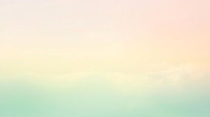 Pastel sky background with soft clouds in gentle shades of pink, yellow and green