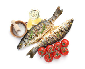 Tasty roasted seabass fish with spices and tomatoes isolated on white, top view. Homemade seafood dish
