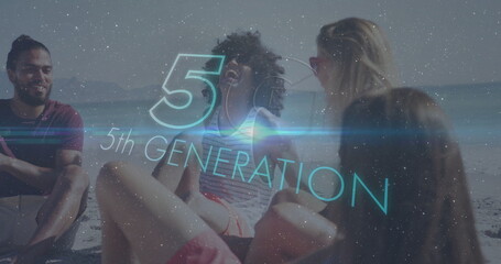 Chatting four friends wearing swimwear and sunglasses sitting on shore with 5th GENERATION overlay