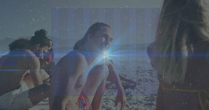 Chatting friends wearing swimwear on sunny beach, holding water bottle and sunglasses