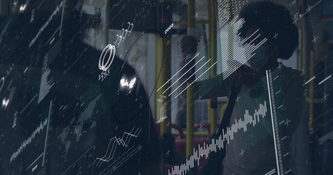 Gripping bus poles by red yellow seats, masked commuter wearing backpack on bus with data overlay - Powered by Adobe