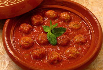 Morocco. Tajine of Kafta - Typical Moroccan and Lebanese dish of meatballs in a tomato sauce with...