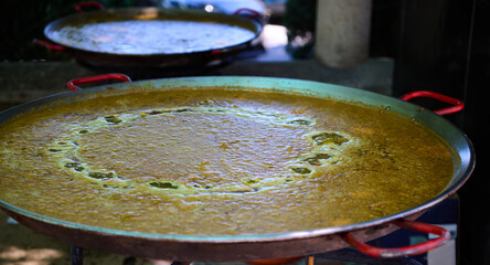 Traditional Spanish Outdoor Paella Preparation During Village Festivities