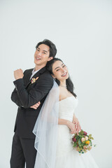 Asian couple getting married, Happy Asian couple in wedding attire, Bride wearing a beautiful white...