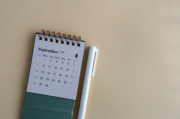Calendar for September 2025. Desktop calendar for planning on a beige background.