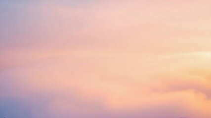 A warm, abstract motion background of soft, dreamy clouds shifting in gentle sunset colors of pink, lavender, and pale orange