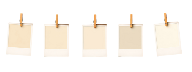 Four blank instant photo frames, attached with wooden clothespins