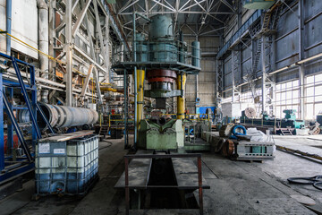 Hydraulic press in pipe factory workshop