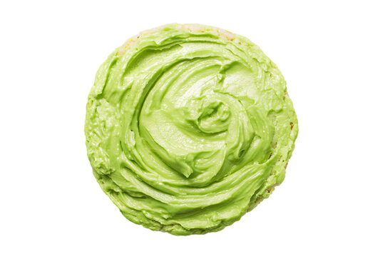 a green frosted cookie with a white background
