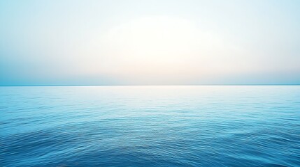 Serene ocean view with soft pastel sky, calm water, seascape, horizon, and tranquility