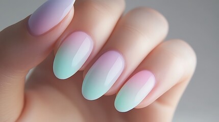 Pastel ombre nails on hand close-up, stylish manicure for women, nail art design