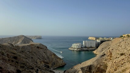 High angle view of sea and buildings against sky in Oman