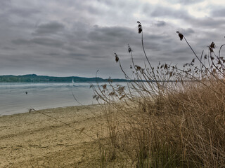 melancholic and lonely lake panorama on a cloudy day