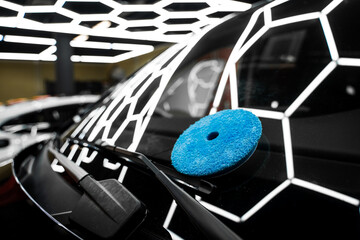 Blue Polishing Pad for Windshield polishing and glass detailing. Blue pad placed on windshield for...