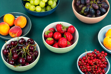 Mix of ripe colorful berries and fruits.
