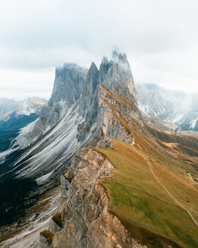 Aerial view of jagged peaks piercing the sky, contrasting with the golden meadows, Seceda, Dolomites, Urtij&Atilde;&laquo;i, Trentino-South Tyrol, Italy.
