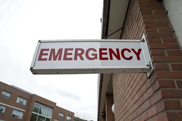 Emergency Room Sign on Brick Building Exterior