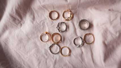 jewelry on a simple background, jewelry aesthetics, jewelry flatlay, gold ring, pearl earrings