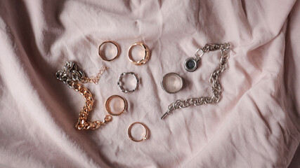 jewelry on a simple background, jewelry aesthetics, jewelry flatlay, gold ring, pearl earrings