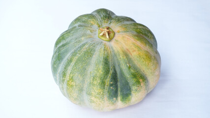 Round Pale Yellow And Green Pumpkin On White Background