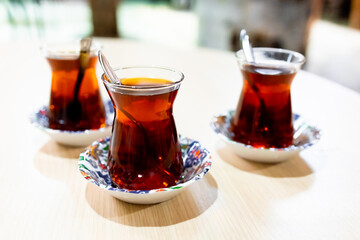 Turkish tea in traditional glasses on wooden table