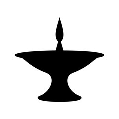 Fototapeta premium Black silhouette of a traditional diya lamp, symbolizing light and spirituality
