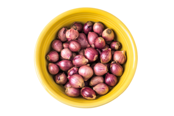 a yellow bowl filled with onions on top of a white table