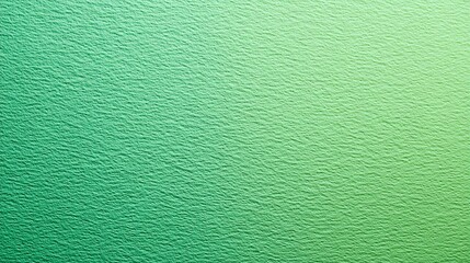 Fototapeta premium Textured green gradient background with subtle variations in shade, creating a soft and soothing visual texture reminiscent of natural surfaces