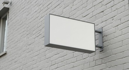 A blank rectangular sign mounted on a brick wall, ready for branding.