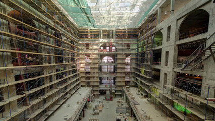 Construction equipment material with scaffolding and tools inside the floor of high rising building timelapse