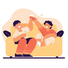 Two happy boys giving each other a high five while sitting on a yellow couch celebrating success together