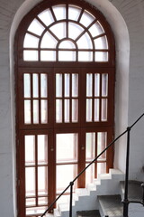 An Elegant Wooden Door is beautifully set in a Bright and Inviting Interior Space