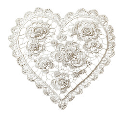 Delicate white lace heart doily with floral design isolated against a transparent background