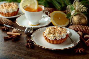 Meringue lemon tart and cup of tea.