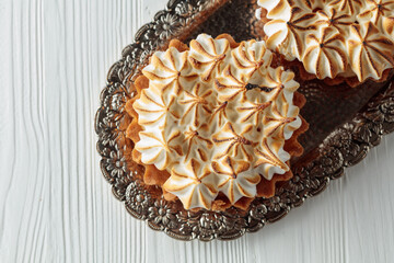 Meringue tartlet on a silver tray.